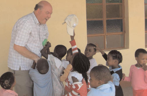 The Very Rev. Terry White visits children in Botswana